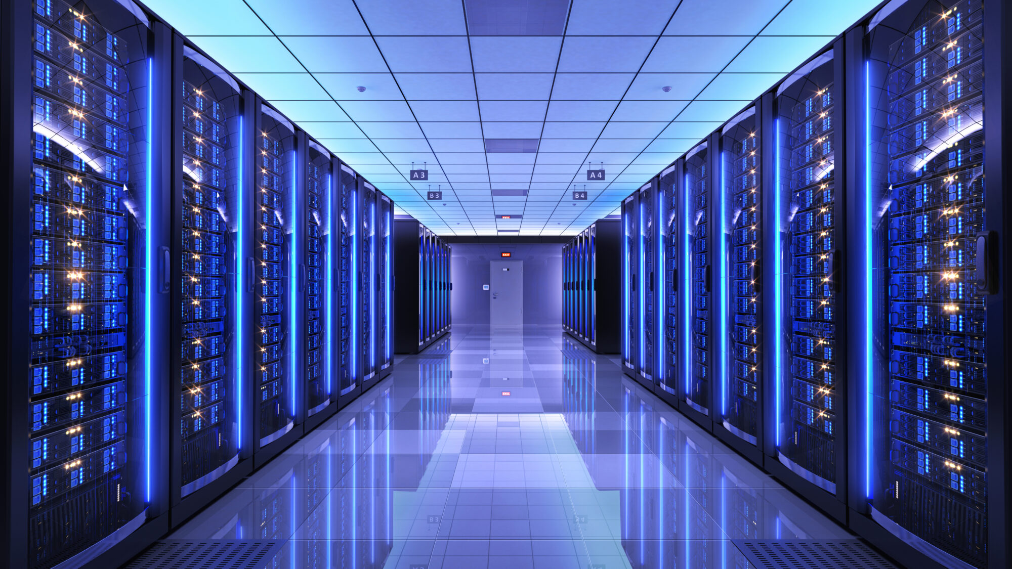 A high-tech data center with rows of illuminated blue server racks representing the growing demand for AI semiconductor materials used in advanced computing.