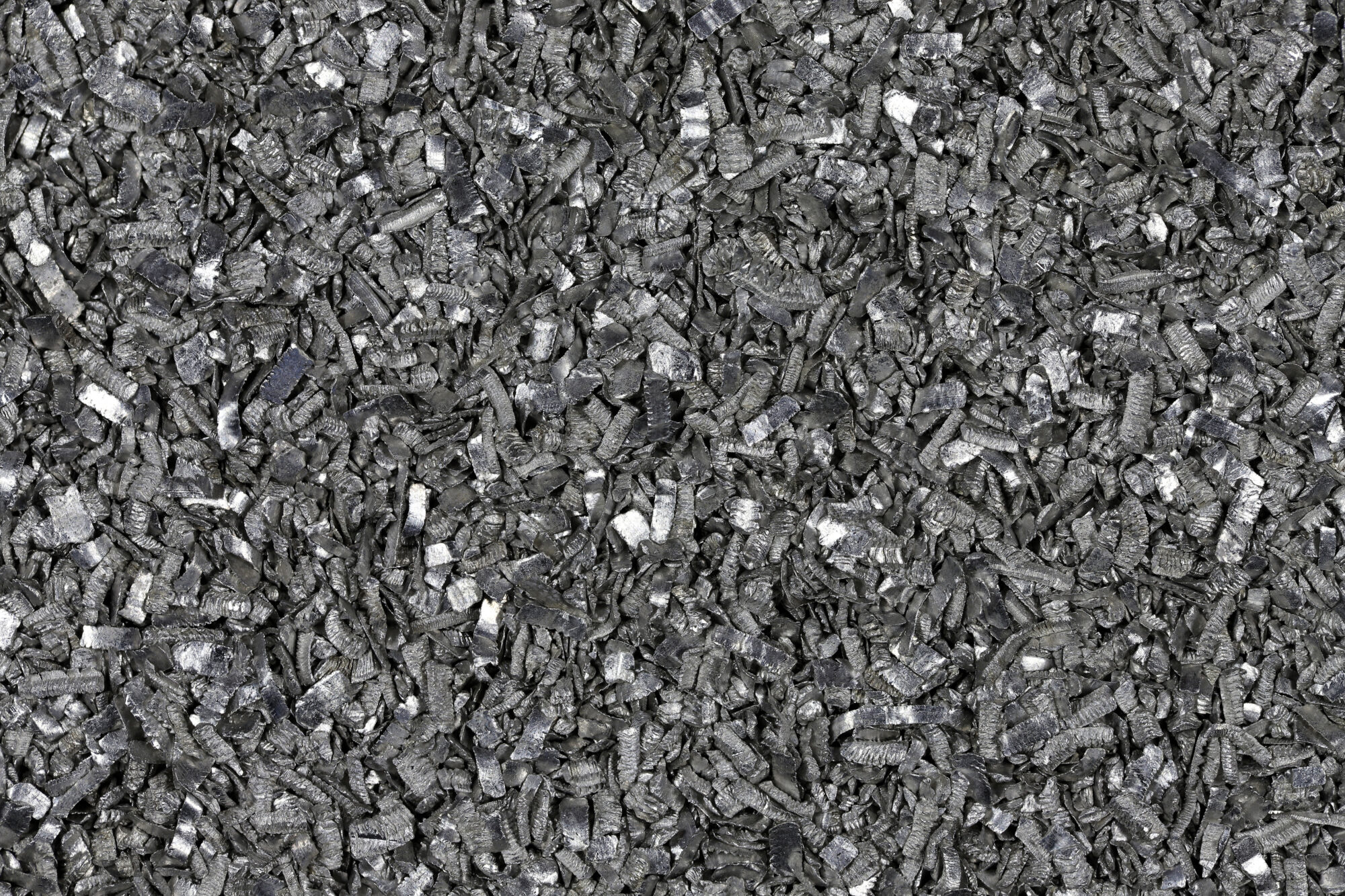 Close-up of raw magnesium metal fragments highlighting global magnesium supply risks and the need for recycling and new sourcing solutions.